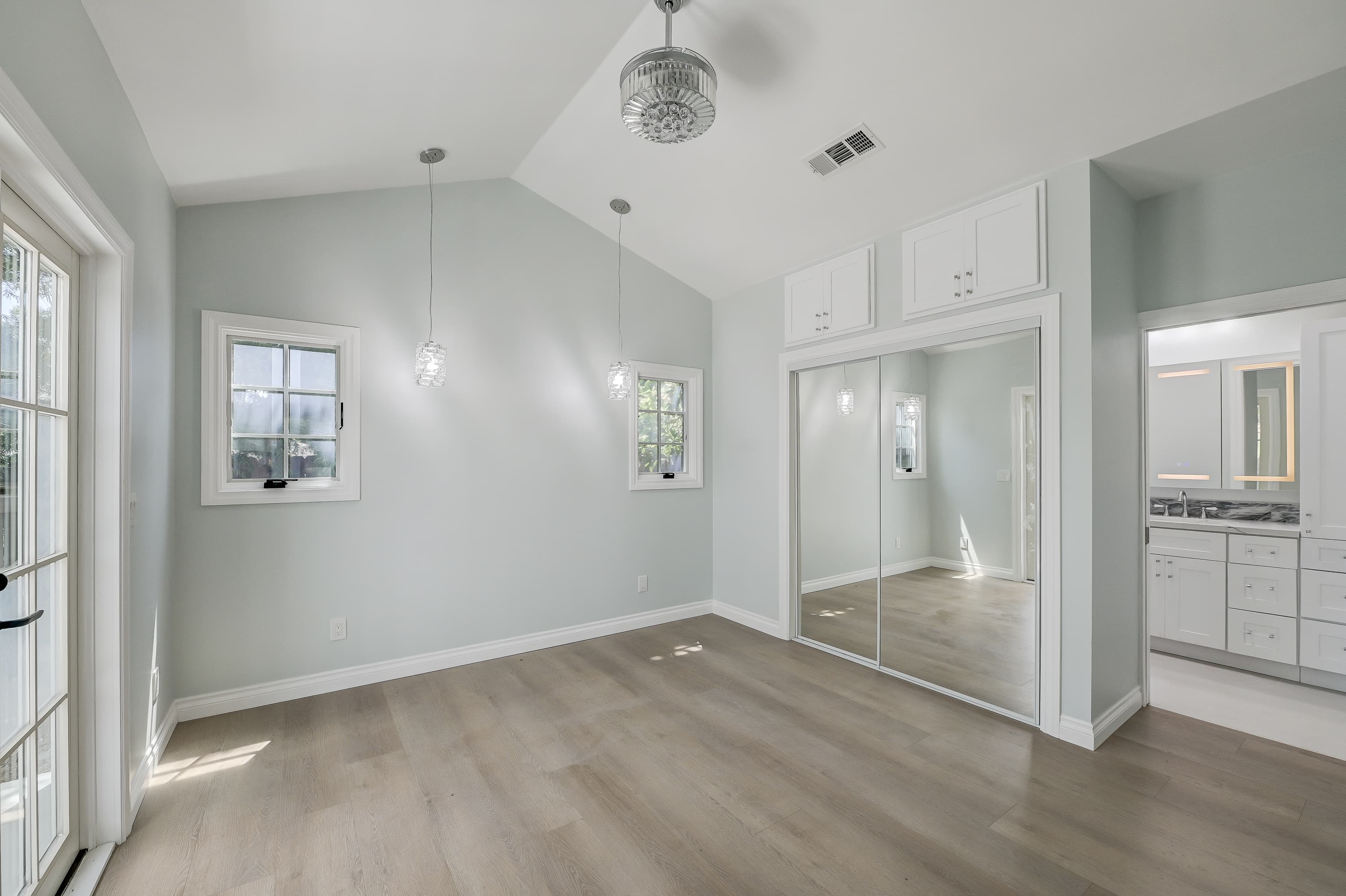Master suite renovation with mirrored built-in closet by Navarro's Custom Homes & ADUs in Southern California